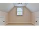 A room with vaulted ceilings, neutral walls, a window, and carpeted floors at 1635 Lake Heights Cir, Dacula, GA 30019