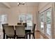 Dining room with wood floors, access to outdoor living space, neutral paint and large windows at 1635 Lake Heights Cir, Dacula, GA 30019