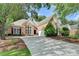 Charming brick home with lush landscaping, a driveway and an attached garage at 1635 Lake Heights Cir, Dacula, GA 30019