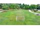 Community sports field with soccer goals, walking path, picnic table and sprinkler system at 1635 Lake Heights Cir, Dacula, GA 30019
