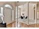 Inviting foyer with hardwood floors, large windows, and a decorative chandelier at 1635 Lake Heights Cir, Dacula, GA 30019