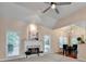 Cozy living room with a fireplace, windows, and a view into the dining area at 1635 Lake Heights Cir, Dacula, GA 30019