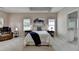 Bright main bedroom boasts neutral walls, plush carpet, and a cozy sitting area at 1635 Lake Heights Cir, Dacula, GA 30019