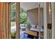 Cozy patio with outdoor seating and view of lush backyard greenery at 1635 Lake Heights Cir, Dacula, GA 30019