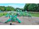 Community playground with multiple slides, climbing structures, and a soft landing surface for safe play at 1635 Lake Heights Cir, Dacula, GA 30019