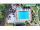 Aerial view of a stunning community pool area with water slides, splash pad, and lounge chairs at 1635 Lake Heights Cir, Dacula, GA 30019