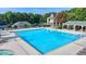 The stunning community pool features lounge chairs, and a covered seating area for relaxation and enjoyment at 1635 Lake Heights Cir, Dacula, GA 30019