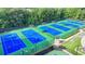 Aerial view of the community's well-maintained tennis courts surrounded by lush greenery at 1635 Lake Heights Cir, Dacula, GA 30019