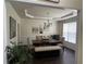 Elegant dining room featuring a tray ceiling, chandelier, and dining table at 223 Sterling Brook Ln, Canton, GA 30114