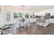 Open kitchen and dining area with hardwood floors and a view to the outdoor deck at 223 Sterling Brook Ln, Canton, GA 30114