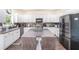 Modern kitchen featuring white cabinets, stainless steel appliances, and a center island with seating at 223 Sterling Brook Ln, Canton, GA 30114