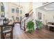 Spacious living room with tall windows and a staircase with wooden handrail at 223 Sterling Brook Ln, Canton, GA 30114