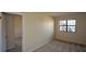 Cozy bedroom with neutral carpet and a large window allowing natural light at 475 Mount Vernon Ne Hwy # C-220, Sandy Springs, GA 30328