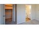 Hallway with closet and access to bathroom at 475 Mount Vernon Ne Hwy # C-220, Sandy Springs, GA 30328