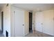 Neutral hallway with carpet and white doors offers access to a walk-in closet at 475 Mount Vernon Ne Hwy # C-220, Sandy Springs, GA 30328