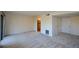 Bright living room features neutral carpeting and entrance to the kitchen area at 475 Mount Vernon Ne Hwy # C-220, Sandy Springs, GA 30328