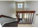 Interior stairwell featuring a unique wooden handrail design with a window at the top at 475 Mount Vernon Ne Hwy # C-220, Sandy Springs, GA 30328