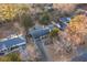 Expansive aerial view of a house with a long driveway and mature trees and swimming pool in the background at 4908 Mill Brook Dr, Atlanta, GA 30338