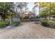 Wide backyard view with a shed, pergola, mature trees, and a wooden fence at 4908 Mill Brook Dr, Atlanta, GA 30338