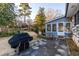 Spacious backyard featuring a concrete patio, mature trees, and a wooden fence at 4908 Mill Brook Dr, Atlanta, GA 30338