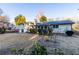 Large, grassy backyard featuring the home's exterior, mature trees and foliage at 4908 Mill Brook Dr, Atlanta, GA 30338