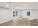 Finished basement with new flooring, natural light, and sliding door access to the outdoors at 4908 Mill Brook Dr, Atlanta, GA 30338