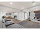 Finished basement with plank floors, a cozy seating area, and a modern entertainment center at 4908 Mill Brook Dr, Atlanta, GA 30338