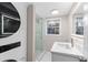 Bathroom featuring a glass enclosed shower and updated vanity with granite countertops at 4908 Mill Brook Dr, Atlanta, GA 30338