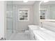 Modern bathroom with dual sinks, a glass-enclosed shower, and stylish fixtures at 4908 Mill Brook Dr, Atlanta, GA 30338