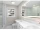 Modern bathroom with dual sinks, a glass-enclosed shower, and stylish fixtures at 4908 Mill Brook Dr, Atlanta, GA 30338