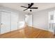 Bedroom with hardwood floors, ceiling fan and access to an attached bathroom at 4908 Mill Brook Dr, Atlanta, GA 30338