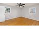 Light-filled bedroom with hardwood floors, neutral paint, and a ceiling fan for added comfort at 4908 Mill Brook Dr, Atlanta, GA 30338