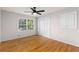Cozy bedroom featuring hardwood floors, ample natural light, and closet space at 4908 Mill Brook Dr, Atlanta, GA 30338