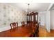 Formal dining room showcasing hardwood floors, chandelier, and china cabinet at 4908 Mill Brook Dr, Atlanta, GA 30338