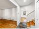 Open foyer with hardwood floors, access to stairs and a separate living area at 4908 Mill Brook Dr, Atlanta, GA 30338