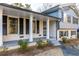 Charming one-story home featuring a brick facade, black shutters, and a covered front porch at 4908 Mill Brook Dr, Atlanta, GA 30338