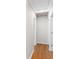 Hallway with hardwood flooring and fresh white paint, leading to various rooms in the home at 4908 Mill Brook Dr, Atlanta, GA 30338