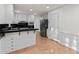 Spacious kitchen boasts white cabinets, black countertops, and modern appliances at 4908 Mill Brook Dr, Atlanta, GA 30338