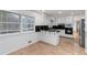 Bright kitchen with large windows, white cabinets, and tile flooring, stainless steel appliances at 4908 Mill Brook Dr, Atlanta, GA 30338
