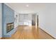 Spacious living room featuring a blue brick fireplace and hardwood floors at 4908 Mill Brook Dr, Atlanta, GA 30338