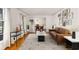 Bright living room with hardwood floors, modern decor, and a view into the dining room at 4908 Mill Brook Dr, Atlanta, GA 30338