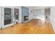 Open living room featuring a cozy fireplace, built-in shelves, and hardwood floors at 4908 Mill Brook Dr, Atlanta, GA 30338