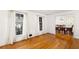 Sunlit living room with hardwood floors, leading into dining area at 4908 Mill Brook Dr, Atlanta, GA 30338