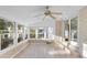 Inviting sunroom bathed in sunlight, complete with tiled floors and access to the outdoors at 4908 Mill Brook Dr, Atlanta, GA 30338