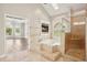Luxurious bathroom with a soaking tub, glass shower, and natural lighting at 5661 Rutland Trce, Lithonia, GA 30058