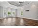 Spacious bedroom featuring hardwood floors, trey ceilings, and natural lighting at 5661 Rutland Trce, Lithonia, GA 30058