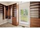 Walk-in closet with custom shelves and ample storage space at 5661 Rutland Trce, Lithonia, GA 30058