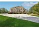 Spacious home with a circular driveway, manicured lawn, and tasteful landscaping at 5661 Rutland Trce, Lithonia, GA 30058