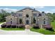 Elegant brick home with symmetrical design, arched windows, and beautifully landscaped front yard at 5661 Rutland Trce, Lithonia, GA 30058