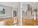 Welcoming foyer with hardwood floors, grand staircase, and abundant natural light at 5661 Rutland Trce, Lithonia, GA 30058